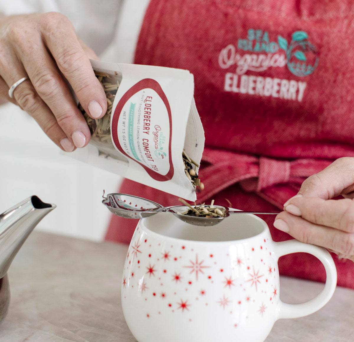 Minde Herbert, owner of Sea Island Organics, makes elderberry tea in her kitchen.