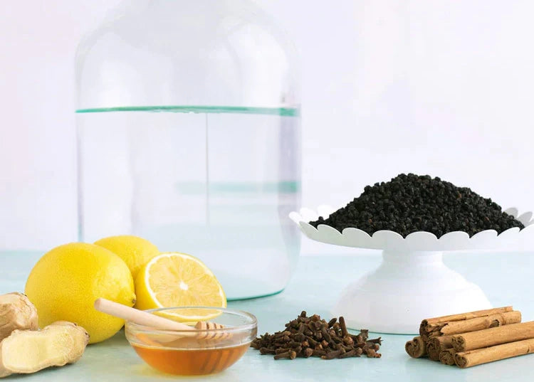 An assortment of ingredients used in Sea Island Organics Elderberry Syrup